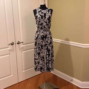 LONDON TIMES coulotte romper one piece. Black with white floral. Size 6